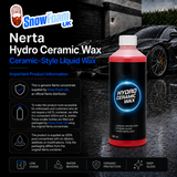 A bottle of Snowfoam UK Nerta Hydro Ceramic Wax liquid wax is shown in front of a dark car on a wet road. The bottle has a black label with blue and white text, and the wax inside is a bright pinkish-red.